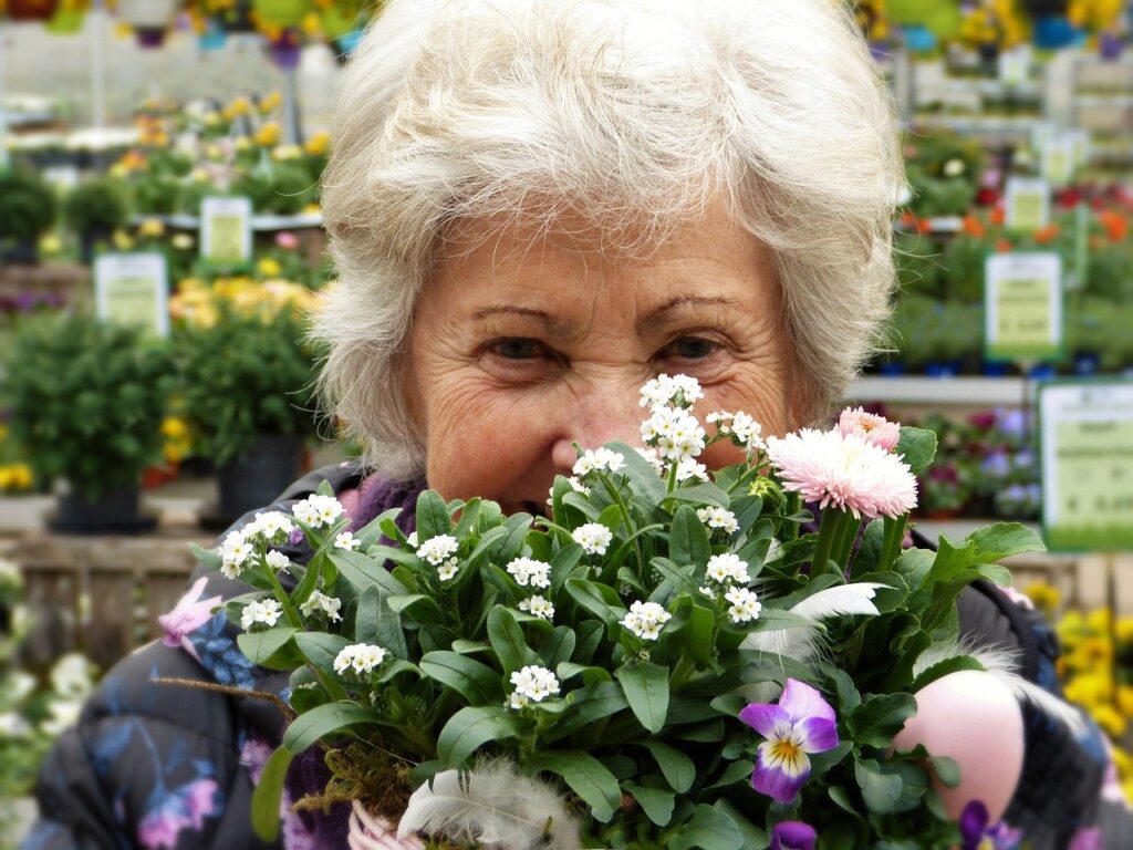 this is about the happy woman holding a flower.